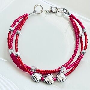 Triple Strand Triple Metal Hearts Pink & Red Bracelet